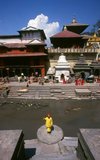 The most revered Hindu site in Nepal is the extensive Pashupatinath Temple complex, five kilometres east of central Kathmandu. The focus of devotion here is a large silver Shivalingam with four faces of Shiva carved on its sides, making it a 'Chaturmukhi-Linga', or four-faced Shivalingam. Pashupati is one of Shiva’s 1,008 names, his manifestation as 'Lord of all Beasts' (pashu means 'beasts', pati means 'lord'); he is considered the guardian deity of Nepal.<br/><br/> 

The main temple building around the Shivalingam was built under King Birpalendra Malla in 1696, however the temple is said to have already existed before 533 CE. In 733 CE, King Jayadeva II erected in its precincts a stone tablet which chronicled all the kings of Nepal, beginning with the sun god. During the Muslim raids of 1349 the temple was largely destroyed, but in 1381 Jayasinharama Varddhana of Banepa restored it. Further renovations were conducted towards the end of the Malla period, and the latest extensive improvements were made in 1967.<br/><br/> 

Since the temple's inception, all the rulers of Nepal have taken great pains to pay their respects to it, to make donations, and to finance extensions.